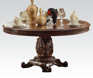 The Vendome traditional dining collection features a pedestal dining table complemented with oversized upholstered chairs all accented by floral carving decorative base and feet. Matching curio reflects all carefully selected design features as the dining