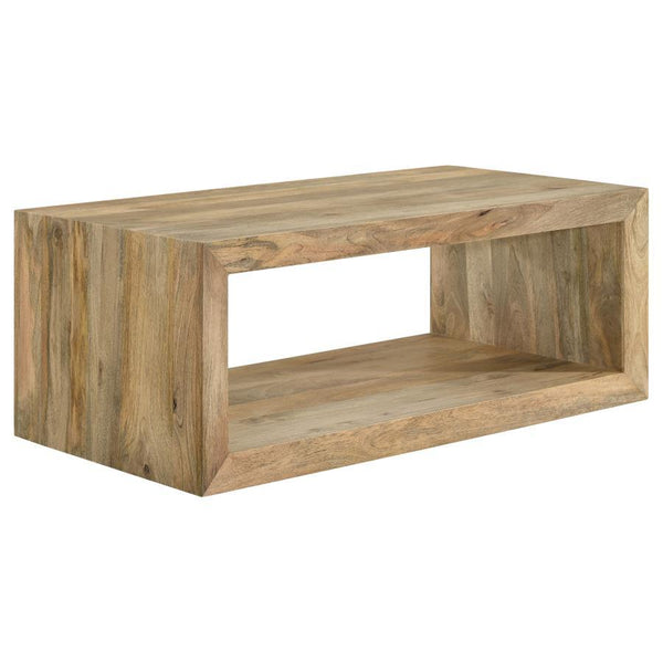 Embracing the very soul of natural design principles, elevate your living room with this rectangular coffee table crafted from solid mango wood. Its natural finish highlights the unique grain patterns, adding warmth and texture to your space. Designed wit