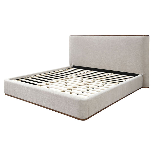 Adorned in elegant gray fabric, exudes contemporary charm with its full upholstered design and low profile footboard. Its soft, luxurious texture invites relaxation, while the minimalist aesthetic enhances any modern bedroom. The Orane collection is a per