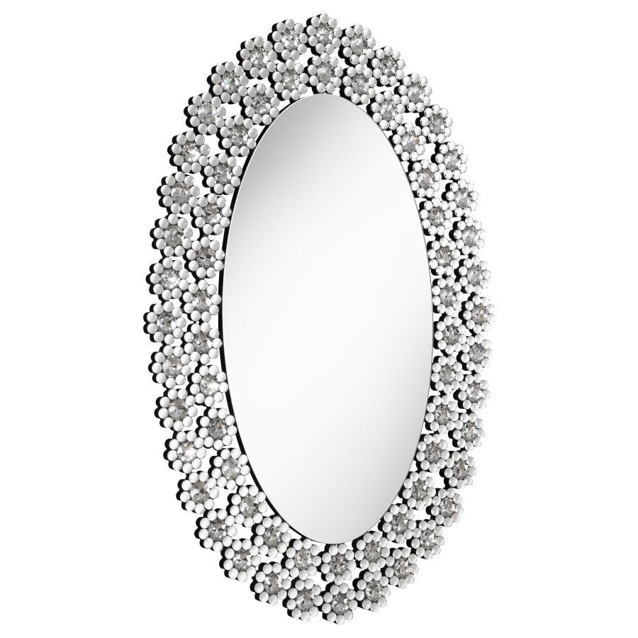 Radiate elegance with this striking oval wall mirror adorned in dazzling faux crystal blossoms. A stunning blend of modern glamour and floral charm, it brightens up any room with its reflective surface and sparkling frame. Perfect for entryways, bathrooms
