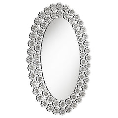 Radiate elegance with this striking oval wall mirror adorned in dazzling faux crystal blossoms. A stunning blend of modern glamour and floral charm, it brightens up any room with its reflective surface and sparkling frame. Perfect for entryways, bathrooms
