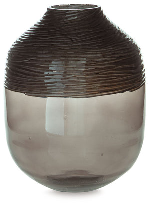 The accent is on contemporary with this exquisite glass vase. Its cool iridescent gray finish and hand-carved pattern deliver a sophisticated statement wherever you like. For those with an artful eye and a love of modern elegance, it-'s a beauty to behold