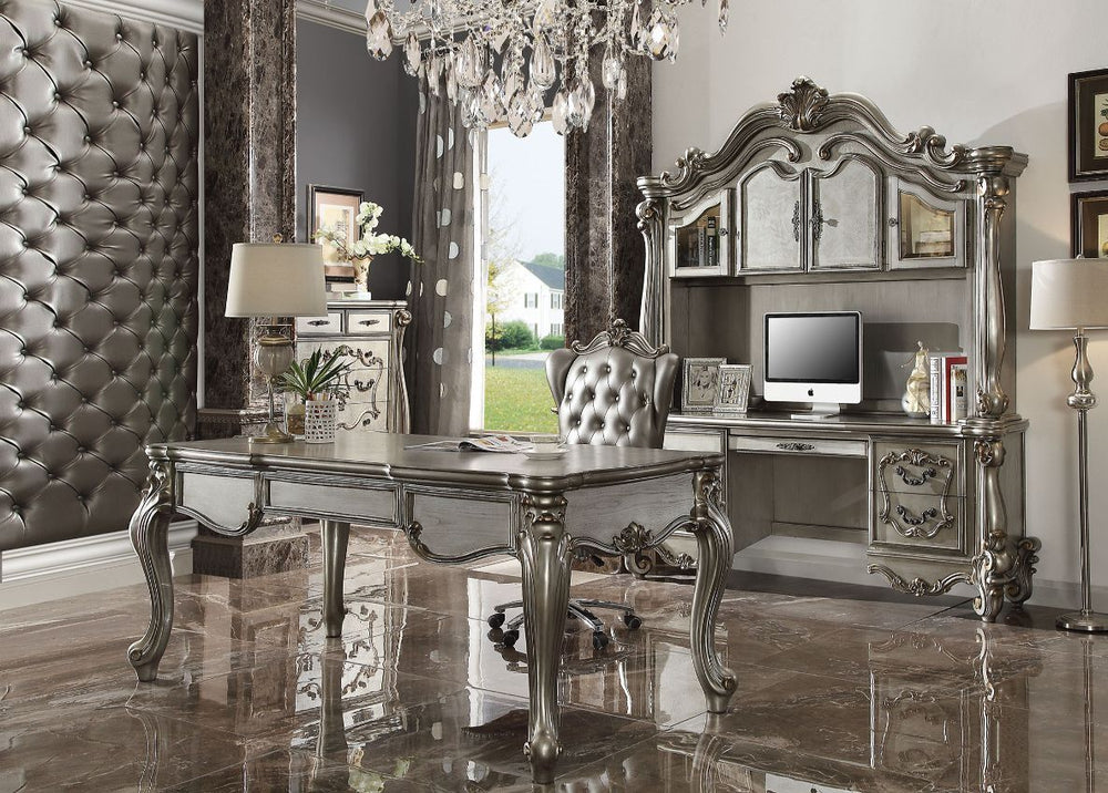 The Versailles office set was inspired by old European design. This collection features carved scrollwork accent with hand-brushed finish. The accent pieces crafted in wood with antique platinum finish and also included regal features such as ample storag