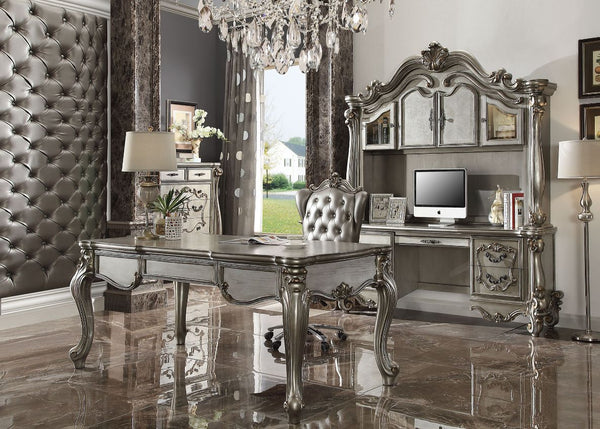 The Versailles office set was inspired by old European design. This collection features carved scrollwork accent with hand-brushed finish. The accent pieces crafted in wood with antique platinum finish and also included regal features such as ample storag