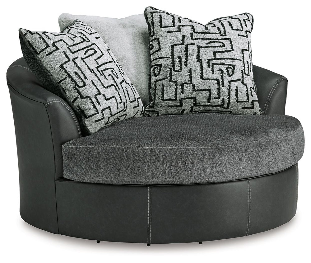 Appeal to your eye for ultra-contemporary design with this oversized swivel chair. Chic and sleek in dark neutrals, it pairs cozy fabric with faux leather for invitingly cool character. And with its robust size offering extra seating space, you can chill 