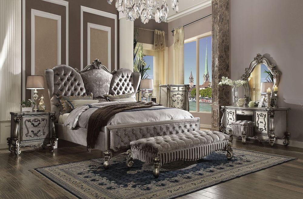 The Versailles collection harmonizes traditional details with functional design to accommodate today-'s styles. This bedroom collection features antique platinum veneers, nailhead trim accents, button tufted headboard/footboard , padded side rails, and ha