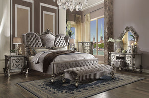 The Versailles collection harmonizes traditional details with functional design to accommodate today-'s styles. This bedroom collection features antique platinum veneers, nailhead trim accents, button tufted headboard/footboard , padded side rails, and ha