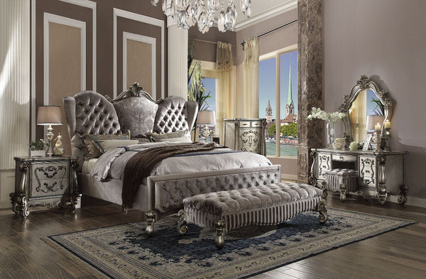 The Versailles collection harmonizes traditional details with functional design to accommodate today-'s styles. This bedroom collection features antique platinum veneers, nailhead trim accents, button tufted headboard/footboard , padded side rails, and ha