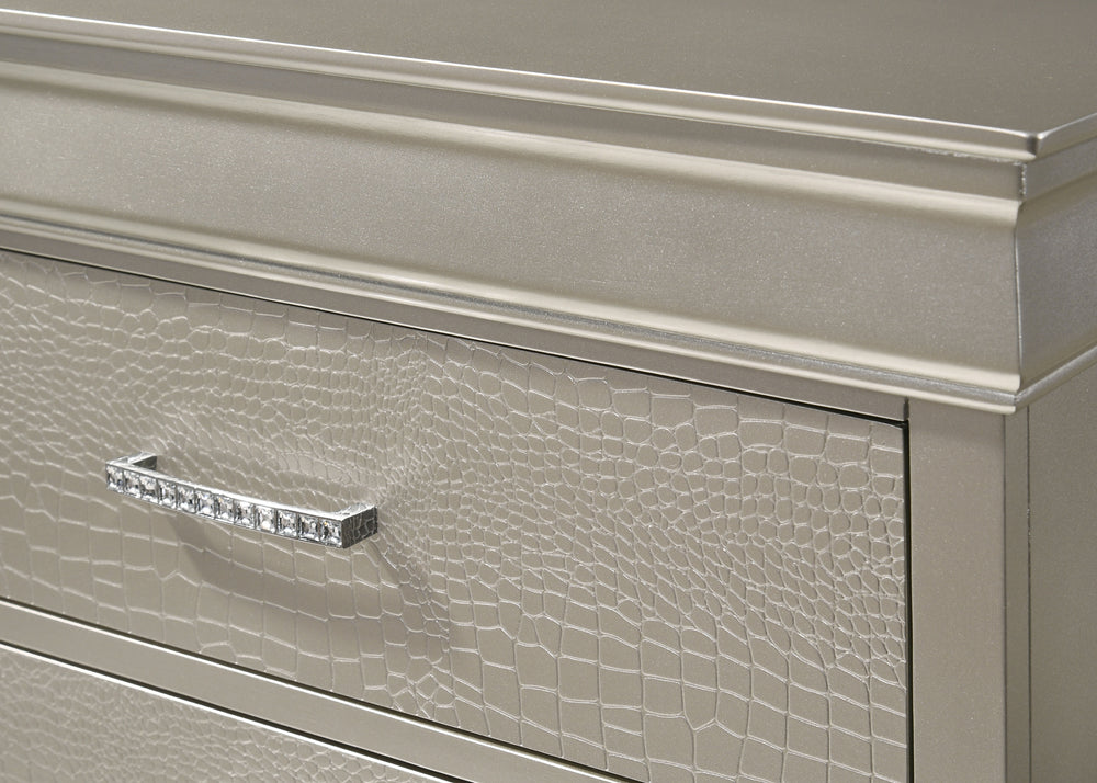 This bedroom set embodies a refined elegance with its soft silver hue and luxurious textures, perfect for creating a serene and sophisticated sanctuary. The centerpiece is a sumptuous bed framed by a headboard with diamond-tufted detailing, offering a tou