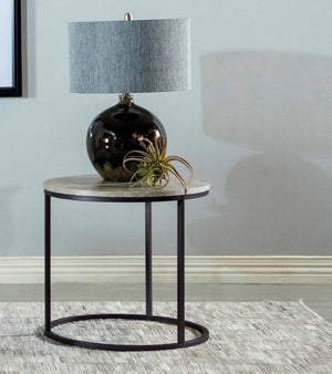  the piece is complemented by a sturdy gunmetal metal base. Its compact size makes it perfect for small