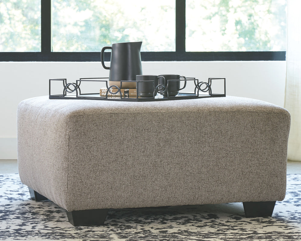 Celebrate strength and durability in design with this oversized accent ottoman. Neutral color opens doors for you to use your imagination with accessorizing the room. Softly textured chenille cushion sports stylish versatility. Throw up your feet or use i
