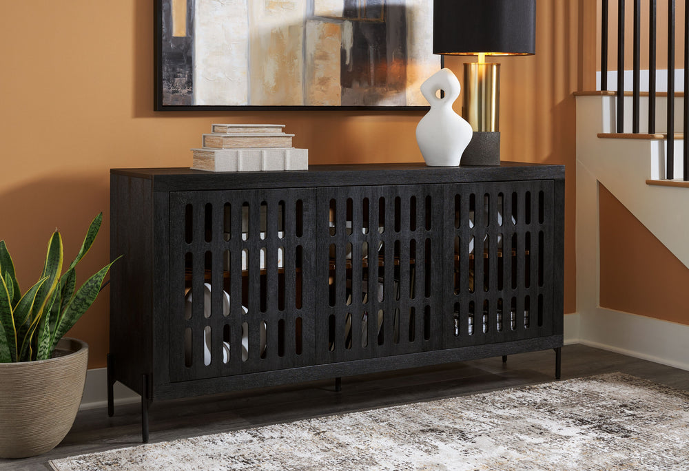 This accent cabinet showcases high-end style with a captivating design. A cleverly placed cutout offers a sneak peek inside, making it a versatile choice for use as a buffet, console or media cabinet. Contemporary and casual, this piece epitomizes laid-ba