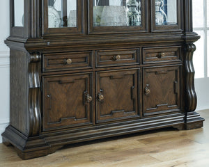  this dining buffet makes a bold statement. With multiple cabinets and drawers to store necessities