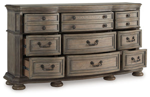  ash swirl veneer inlays and a glazed antiqued-look finish radiate timeless sophistication. Drawers of various sizes are packed 