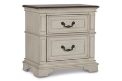 Complete your bedroom ensemble with the New Classic Furniture Anastasia 2 Drawer Nightstand. Crafted with real wood construction from solid poplar and oak veneer, this nightstand ensures long-lasting durability. The heirloom finish, achieved through a mul