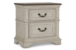 Complete your bedroom ensemble with the New Classic Furniture Anastasia 2 Drawer Nightstand. Crafted with real wood construction from solid poplar and oak veneer, this nightstand ensures long-lasting durability. The heirloom finish, achieved through a mul