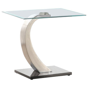 This end table combines style and durability with its tempered glass top and sleek design. The gracefully curved base features a brushed satin silver finish, adding modern elegance, while the polished black platform base provides striking contrast and stu