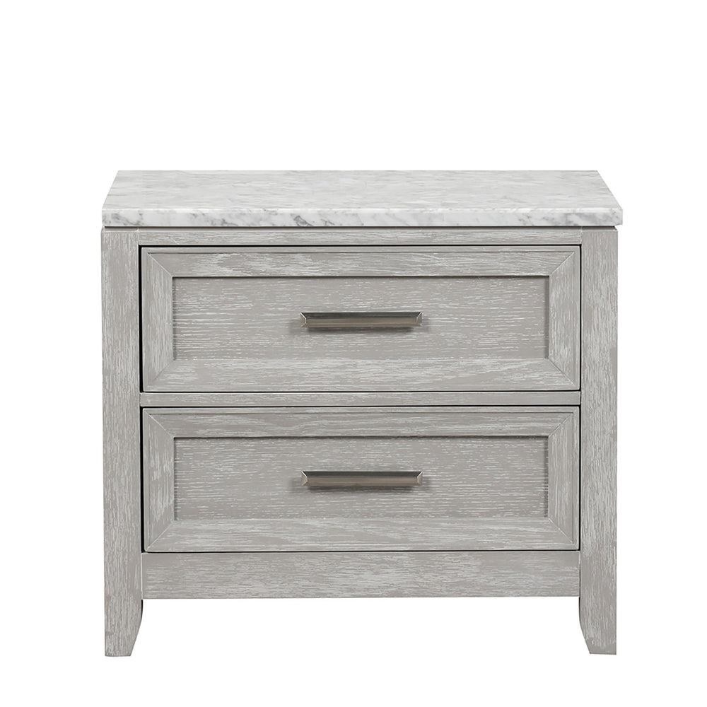 The Fiona Nightstand combines durability with timeless design. Crafted from Acacia Solids, Manufactured Woods, and Oak Veneer, it seamlessly blends the beauty of real wood with robust construction. The multi-step finishing process, including wire brushing