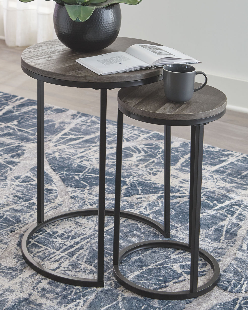 Tight budget? Tight space? Youâ€™re all set with this nesting table set. Clean-lined round design is decidedly contemporary, while gray washed tops serve up casual coolness.<br><br><b>Additional Dimensions</b><br><ul><li>Table-large: 0-"</li><li>Table-sma