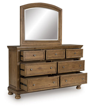  this dresser with mirror strikes a comfy pose with a classic sensibility. Its timeless design and chestnut brown wood tone create a welcoming retreat tailored to your laid-back lifestyle. Metal knobs in an aged