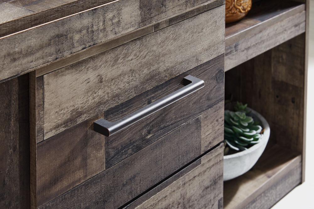 Make this entertainment center the center of attention with its popular urban eclectic style. Its rustic finish over a replicated pine grain creates an authentic natural look for your home entertainment area. You-'ll love its functionality. Two tall piers