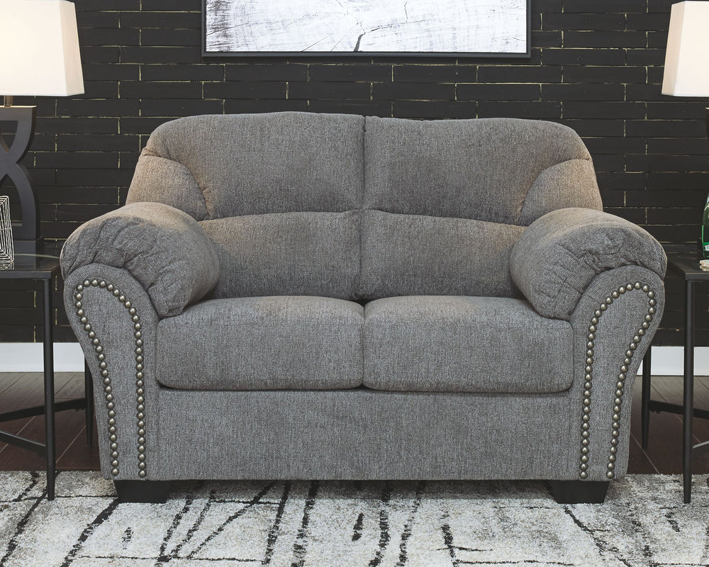 Why sacrifice comfort for style (or style for comfort) when you can have the best of both in this loveseat in pewter gray. Elements include a chic divided-back design and pillow top wrapped armrests that make nodding off all too easy. Calling attention to