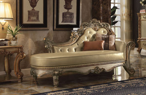 Create an elegant, traditional design in your room with the Vendome Chaise. A hand-crafted piece inspired from the luxurious designs of the past, the beautiful bench features a beige button-tufted back with Nailhead trim, two accent pillows, and elaborate