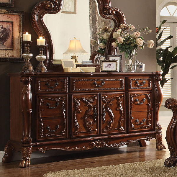 The Dresden Dresser/Server is crafted with the finest solid woods with veneers in cherry oak finish. Dresden Collection is enhanced by remarkable marquetry and generously carved wood elements. The case goods feature solid hardwood with five drawers and tw