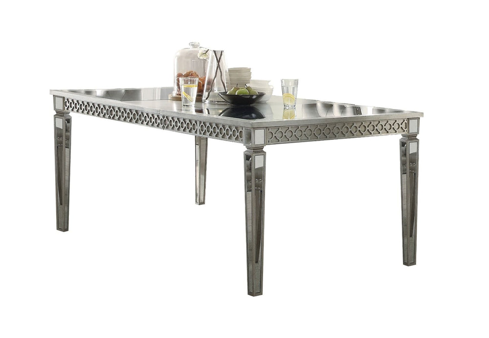 Crafted with past and present in mind, our Kacela dining collection revitalizes and transforms traditional designing ideas. A grand centerpiece, the rectangular table is handsomely finished and enriched by tapered legs and mirror insert top and edges. Pai