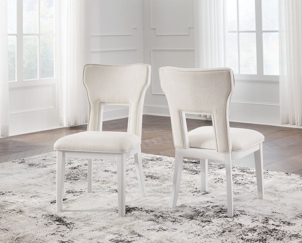 Embracing modern glamour, this dining chair is a dazzling addition to your dining area. A bright white lacquer finish and a contemporary cutout design give it a look all its own. The sumptuous upholstery wows with metallic thread accents.<br><br><b>Additi