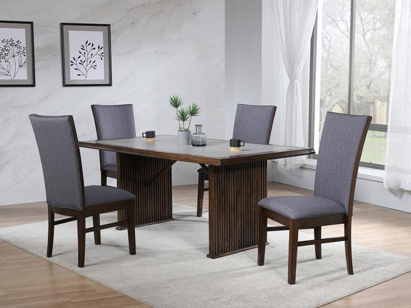 Transform your dining area with this sophisticated dining set, featuring a 72-inch reeded dining table and complementing upholstered side chairs. The table-'s ceramic top combines elegance and durability, while the reeded base adds texture and timeless ap