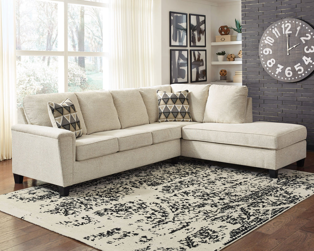 If youâ€™re looking to lighten the mood, youâ€™re sure to find this budget-conscious sectional beautifully fits the bill. Covered in a creme chenille upholstery loaded with plush texture, this less-is-more contemporary sectional is dressed to impress with