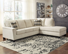 If youâ€™re looking to lighten the mood, youâ€™re sure to find this budget-conscious sectional beautifully fits the bill. Covered in a creme chenille upholstery loaded with plush texture, this less-is-more contemporary sectional is dressed to impress with