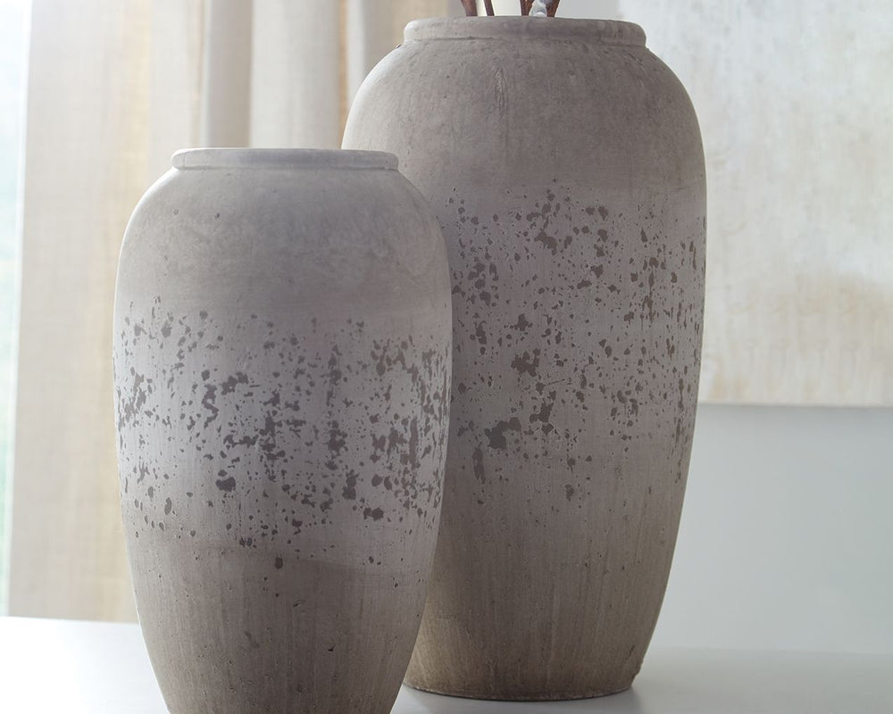 Is your home curated rather than simply decorated? Add another thoughtful piece into the mix with this 2-piece vase set. Brown and antique cream painted ceramic has a unique weatherworn finish. Add fresh florals for a vintage-inspired look.<br><br><b>Addi