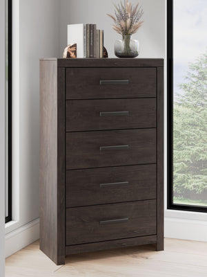  this chest of drawers is a simply chic approach to modern living. A dark charcoal finish blends black and brown undertones