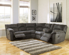 With plush cushions and wraparound pillow top arms, this sectional takes comfort to a whole new level. Faux vintage leather requires minimal care, making this relaxation station ideal in homes with children and pets. Reclining feature engages with the pul