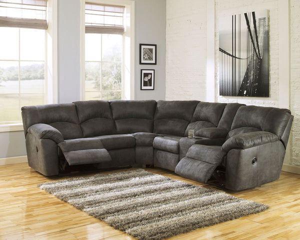 With plush cushions and wraparound pillow top arms, this sectional takes comfort to a whole new level. Faux vintage leather requires minimal care, making this relaxation station ideal in homes with children and pets. Reclining feature engages with the pul