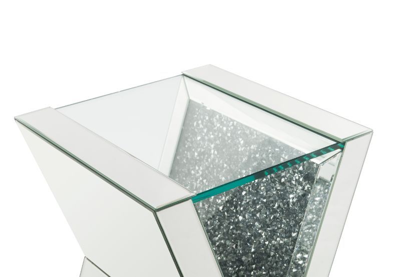 Brighten up your space with this stunning end table. With its distinctive V shaped pedestal base, this table is one your friends and family will all be envious of and will be talking about for years to come. The faux diamond inlay adds the right amount of