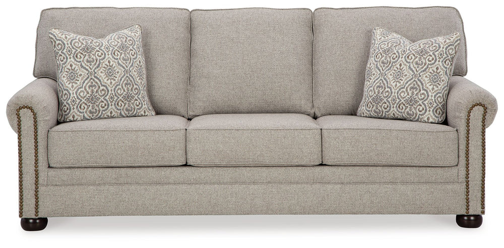 Inspired by the past but rooted firmly in the present, this sofa complements your transitional seating area. Its versatile upholstery is delightfully detailed for a subtle herringbone effect. Designer touches like decorative nailhead trim and bun legs add