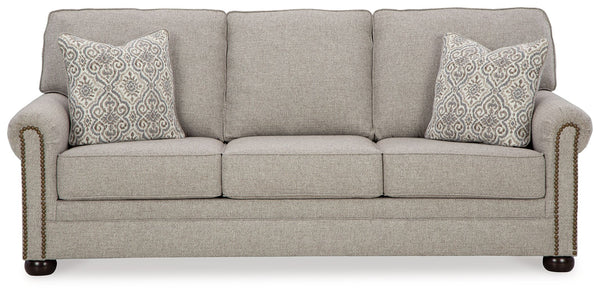 Inspired by the past but rooted firmly in the present, this sofa complements your transitional seating area. Its versatile upholstery is delightfully detailed for a subtle herringbone effect. Designer touches like decorative nailhead trim and bun legs add