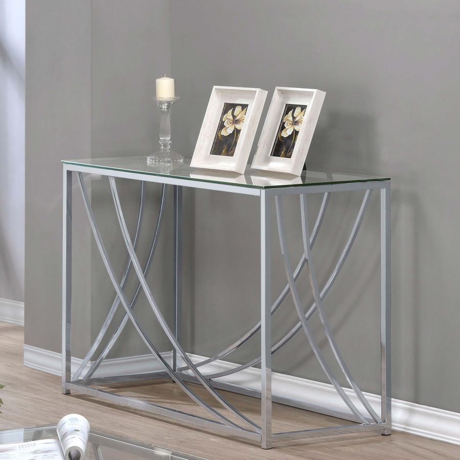 This rectangular console table combines modern elegance with practical design. Featuring a clear tempered glass top, it offers both durability and style. The electroplated chrome frame adds a sleek, polished finish, while gracefully curved metal accents e