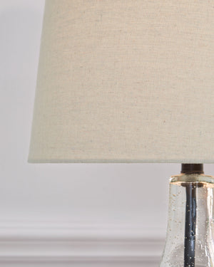  this pair of lamps feature a straight post body enhanced in curvaceous seeded glass. Up top