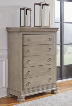 Traditional design motifs, redefined for todayâ€™s trends. Inspired by timeless Louis Philippe styling, this chest of drawers is distinguished by its stunning attention to detail. Youâ€™ll find the light gray finish encourages an attitude of laid-back lux