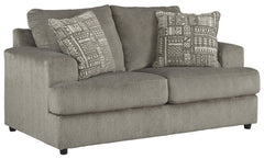 Flaunting a trendsetting silhouette, this loveseat puts the contemporary in your contemporary home. Its â€œthree over twoâ€ profile eliminates the center seat cushion, giving you elongated plushness and deep seating. And the microfiber fabric satisfies y