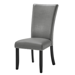Upgrade your dining area with the Lyra Upholstered Dining Chairs. This set of two chairs feature a sleek gray upholstery that exudes contemporary glam, complemented by black legs and elegant silver nail head trim. Crafted from a combination of solid and m