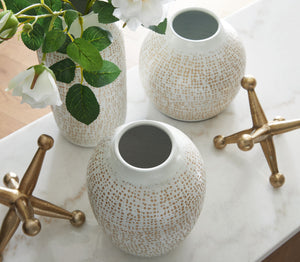  are perfect for displaying your favorite faux blooms or standing alone as minimalist statements. They-'re paired with bold geometric sculpt