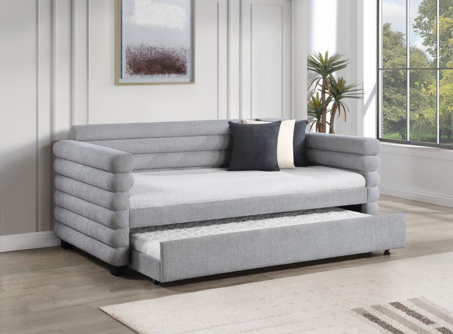 You-'re going to love the intriguing silhouette and boucle upholstery featured on this modern daybed and trundle. Offering contemporary flair, the daybed is designed with layered round bolsters, creating exceptional texture and dimensionality in your livi