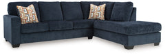 Looking to make a bold statement with color? Liven up your living room with this sectional with chaise. Its trend-right navy blue upholstery adds a playful pop of color to your decor. Bold and eclectic accent pillows complete the look. Pairing posh style 