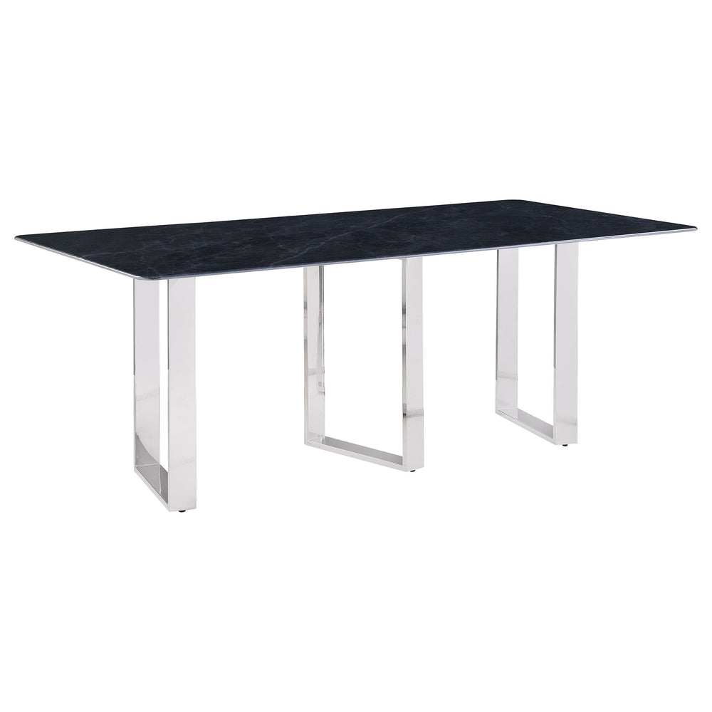 Inject a sense of sophistication with a modern rectangular dining table. Featuring a sintered stone tabletop with a gray marble finish and slim, sleek silhouette, the table becomes a stylish centerpiece in your dining room. It stands on three open frame l