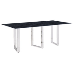 Inject a sense of sophistication with a modern rectangular dining table. Featuring a sintered stone tabletop with a gray marble finish and slim, sleek silhouette, the table becomes a stylish centerpiece in your dining room. It stands on three open frame l